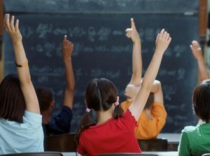 school-kids-classroom-raising-hands