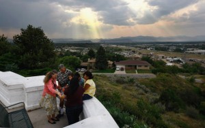 Hospice chaplain Claire Nord (L), prays with Ken Sheel, terminally ill with pancreatic cancer, and his family at a park while on a home hospice visit on August 31, 2009 in Denver, Colorado.